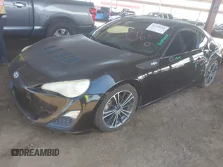 2014 Scion FR-S z VIN JF1ZNAA18E9704218, wystawiony jako IAAI lot #42348298 z przebiegiem 107 122 mil mil oraz . Historia ofert i sprzedaży dostępna na DreamBid. Obrazek 2.