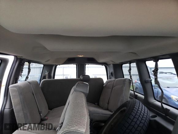 2012 Chevrolet Express Passenger 1LT with VIN 1GAZGYFG8C1174282, listed as a Copart auction lot 86012024 with 170,680 mi miles and Salvage title. Bid and sale history available at DreamBid. Image 10.