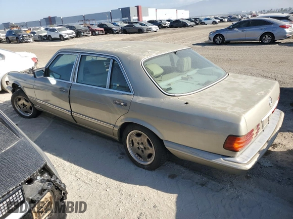 1989 Mercedes-Benz 560 with VIN WDBCA39E8KA469603, listed as a Copart auction lot 82986634 with 81,490 mi miles and Clean Title. Bid and sale history available at DreamBid. Image 2.