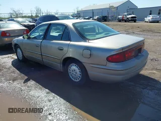 1997 Buick Regal LS with VIN 2G4WB52K9V1435882, listed as a IAAI auction lot 41974673 with 64,402 mi miles. Bid and sale history available at carsss.com. Image 3.