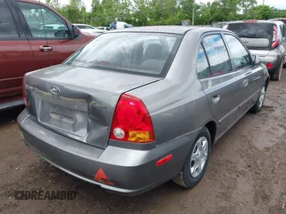 2004 Hyundai Accent GL z VIN KMHCG45C04U502892, wystawiony jako IAAI lot #42309078 z przebiegiem 127 362 mil mil oraz . Historia ofert i sprzedaży dostępna na DreamBid. Obrazek 4.