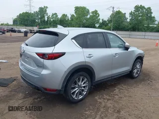 2021 Mazda CX-5 Grand Touring with VIN JM3KFBDM4M0371496, listed as a IAAI auction lot 42428860 with 113,735 mi miles and . Bid and sale history available at DreamBid. Image 4.