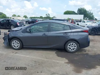 2021 Toyota Prius L Eco z VIN JTDKAMFU3M3152785, wystawiony jako IAAI lot #42501351 z przebiegiem 60 489 mil mil oraz . Historia ofert i sprzedaży dostępna na DreamBid. Obrazek 14.