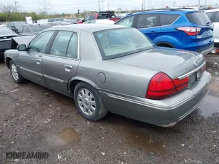 2003 Mercury Grand Marquis LS Premium with VIN 2MEFM75W33X655360, listed as a IAAI auction lot 41922734 with 86,059 mi miles. Bid and sale history available at carsss.com. Image 3.