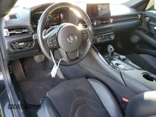 2022 Toyota GR Supra 2.0 with VIN WZ1DB2C08NW047883, listed as a Copart auction lot 84032614 with 26,907 mi miles and Salvage Title. Bid and sale history available at carsss.com. Image 8.
