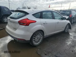 2016 Ford Focus Electric z VIN 1FADP3R41GL257400, wystawiony jako Copart lot #82003833 z przebiegiem 69 426 mil mil oraz . Historia ofert i sprzedaży dostępna na DreamBid. Obrazek 3.