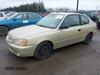 2002 Hyundai Accent GL with VIN KMHCG35CX2U199532, listed as a IAAI auction lot 41839270 with 200,232 mi miles. Bid and sale history available at carsss.com. Image 2.