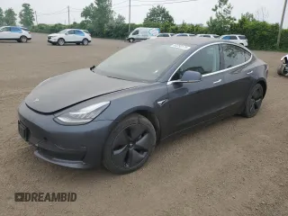 2018 Tesla Model 3 Long Range Battery z VIN 5YJ3E1EA2JF021280, wystawiony jako Copart lot #60250175 z przebiegiem 99 248 mil mil oraz Szkoda całkowita • Salvage title. Historia ofert i sprzedaży dostępna na DreamBid. Obrazek 1.