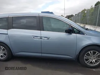 2012 Honda Odyssey EX-L with VIN 5FNRL5H60CB095086, listed as a IAAI auction lot 42251330 with 144,232 mi miles and . Bid and sale history available at DreamBid. Image 13.