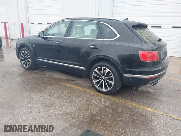 2019 Bentley Bentayga V8 z VIN SJAAM2ZVXKC025218, wystawiony jako IAAI lot #41741586 z przebiegiem 52 457 mil mil oraz . Historia ofert i sprzedaży dostępna na DreamBid. Obrazek 3.