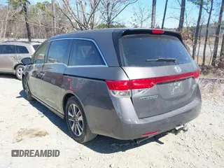2014 Honda Odyssey Touring with VIN 5FNRL5H92EB016546, listed as a IAAI auction lot 41689148 with 143,601 mi miles and . Bid and sale history available at DreamBid. Image 3.