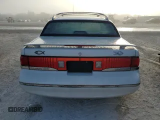 1997 Mercury Cougar z VIN 1MELM62W0VH602622, wystawiony jako Copart lot #77042354 z przebiegiem 122 027 mil mil oraz Nie do naprawy. Historia ofert i sprzedaży dostępna na DreamBid. Obrazek 6.