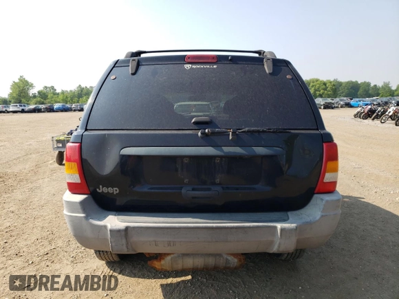 2000 Jeep Grand Cherokee Laredo with VIN 1J4GW48S6YC404063, listed as a Copart auction lot 59442725 with 268,543 mi miles and Salvage title. Bid and sale history available at DreamBid. Image 6.