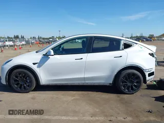 2022 Tesla Model Y Long Range with VIN 7SAYGDEE1NF364241, listed as a IAAI auction lot 42190272 with 54,878 mi miles and . Bid and sale history available at DreamBid. Image 14.