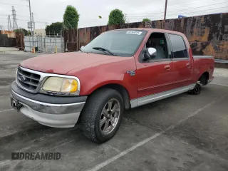 2001 Ford F-150 XLT with VIN 1FTRW07WX1KE51166, listed as a Copart auction lot 60164025 with 157,035 mi miles and Salvage title. Bid and sale history available at DreamBid. Image 1.
