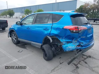 2018 Toyota RAV4 LE with VIN 2T3BFREV6JW740214, listed as a IAAI auction lot 42106349 with 105,831 mi miles and . Bid and sale history available at carsss.com. Image 3.