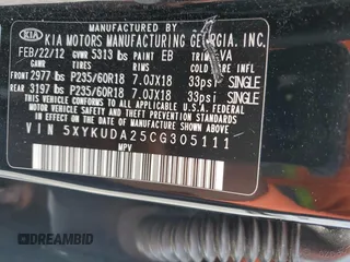 2012 Kia Sorento EX z VIN 5XYKUDA25CG305111, wystawiony jako Copart lot #54216645 z przebiegiem 111 841 mil mil oraz Szkoda całkowita • Salvage title. Historia ofert i sprzedaży dostępna na DreamBid. Obrazek 13.