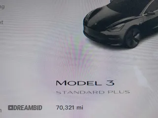 2019 Tesla Model 3 Mid Range with VIN 5YJ3E1EA2KF362048, listed as a IAAI auction lot 40141734 with 70,321 mi miles and . Bid and sale history available at carsss.com. Image 14.