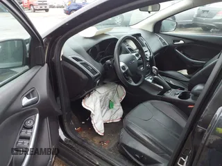2014 Ford Focus Titanium with VIN 1FADP3J25EL310199, listed as a IAAI auction lot 40682901 with 84,885 mi miles and . Bid and sale history available at DreamBid. Image 12.