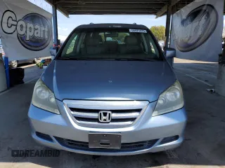 2007 Honda Odyssey EX-L z VIN 5FNRL38647B077250, wystawiony jako Copart lot #56925425 z przebiegiem 159 281 mil mil oraz Szkoda całkowita • Salvage title. Historia ofert i sprzedaży dostępna na DreamBid. Obrazek 5.