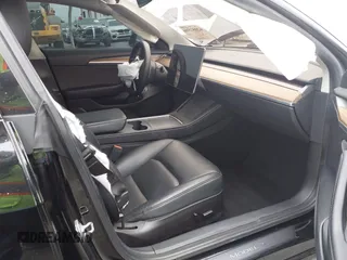 2022 Tesla Model 3 with VIN 5YJ3E1EA7NF314744, listed as a IAAI auction lot 42057596 with 30,936 mi miles and . Bid and sale history available at DreamBid. Image 5.