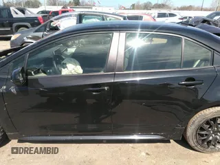 2021 Toyota Corolla LE with VIN JTDEPMAE5MJ126390, listed as a IAAI auction lot 41669331 with 77,398 mi miles. Bid and sale history available at carsss.com. Image 14.