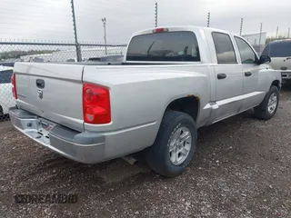 2005 Dodge Dakota SLT with VIN 1D7HE48K25S232893, listed as a IAAI auction lot 41932773 with 209,459 mi miles and . Bid and sale history available at DreamBid. Image 4.