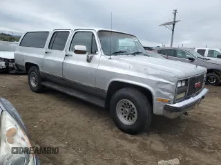 1990 GMC Suburban z VIN 1GKGR26N7LF537148, wystawiony jako Copart lot #45388815 z przebiegiem 265 951 mil mil oraz Tytuł czysty. Historia ofert i sprzedaży dostępna na DreamBid. Obrazek 4.
