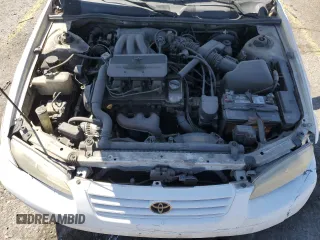 1998 Toyota Camry LE z VIN JT2BF28K3W0115122, wystawiony jako Copart lot #52645095 z przebiegiem 361 549 mil mil oraz Szkoda całkowita • Salvage title. Historia ofert i sprzedaży dostępna na DreamBid. Obrazek 13.