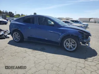 2024 Tesla Model Y Long Range z VIN 7SAYGAEE3RF034699, wystawiony jako Copart lot #54523815 z przebiegiem 9 764 mil mil oraz Szkoda całkowita • Salvage title. Historia ofert i sprzedaży dostępna na DreamBid. Obrazek 4.