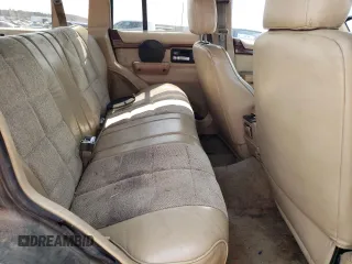 1995 Jeep Cherokee Country with VIN 1J4FJ78S4SL631318, listed as a Copart auction lot 63087634 with 295,577 mi miles and Salvage Title. Bid and sale history available at carsss.com. Image 10.