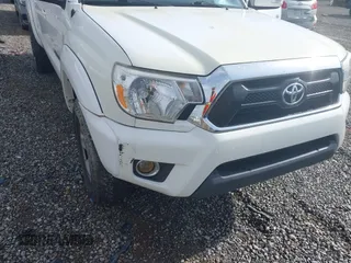 2015 Toyota Tacoma with VIN 3TMLU4EN5FM188601, listed as a IAAI auction lot 41883555 with 143,904 mi miles and . Bid and sale history available at DreamBid. Image 6.