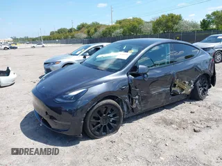 2024 Tesla Model Y with VIN 7SAYGDED3RF019063, listed as a IAAI auction lot 42061888 with 13,763 mi miles and . Bid and sale history available at DreamBid. Image 16.