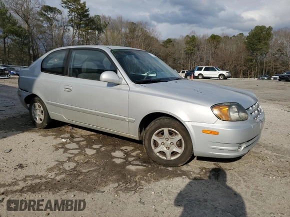 2003 Hyundai Accent GL z VIN KMHCG35CX3U270374, wystawiony jako Copart lot #47240325 z przebiegiem 122 739 mil mil oraz Szkoda całkowita • Salvage title. Historia ofert i sprzedaży dostępna na DreamBid. Obrazek 4.