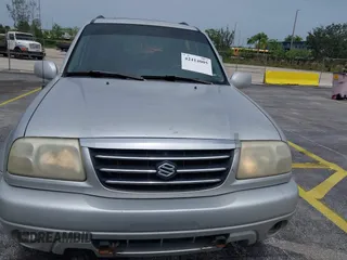 2003 Suzuki XL7 Touring z VIN JS3TX92V434114930, wystawiony jako IAAI lot #42414005 z przebiegiem 148 945 mil mil oraz . Historia ofert i sprzedaży dostępna na DreamBid. Obrazek 6.