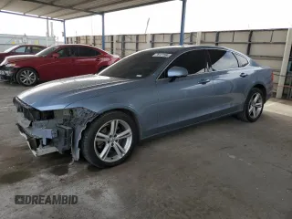 2018 Volvo S90 Momentum z VIN LVY982AK6JP028673, wystawiony jako Copart lot #76127594 z przebiegiem 90 279 mil mil oraz Szkody całkowita. Historia ofert i sprzedaży dostępna na DreamBid. Obrazek 1.