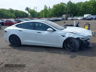2022 Tesla Model S with VIN 5YJSA1E58NF467644, listed as a IAAI auction lot 42344403 with 52,628 mi miles and . Bid and sale history available at DreamBid. Image 13.