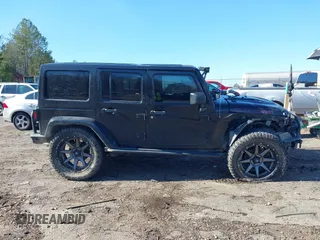 2015 Jeep Wrangler Unlimited Rubicon with VIN 1C4BJWFG9FL755152, listed as a IAAI auction lot 41293766 with 109,153 mi miles. Bid and sale history available at carsss.com. Image 14.