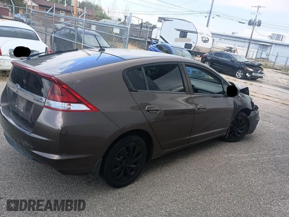 2012 Honda Insight LX with VIN JHMZE2H50CS004626, listed as a Copart auction lot 65198795 with 153,085 mi miles and Clean title. Bid and sale history available at DreamBid. Image 4.