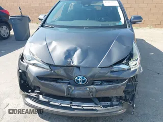 2021 Toyota Prius L Eco with VIN JTDKAMFU4M3144985, listed as a IAAI auction lot 42443957 with 20,816 mi miles and . Bid and sale history available at DreamBid. Image 6.