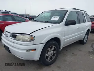 2003 Oldsmobile Bravada z VIN 1GHDT13S732260233, wystawiony jako IAAI lot #41897116 z przebiegiem 119 589 mil mil oraz . Historia ofert i sprzedaży dostępna na DreamBid. Obrazek 2.