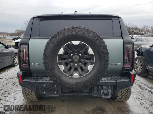 2024 GMC Hummer EV 3X z VIN 1GKB0RDC6RU101989, wystawiony jako Copart lot #85671314 z przebiegiem 7434 mil mil oraz Szkody całkowita. Historia ofert i sprzedaży dostępna na DreamBid. Obrazek 6.