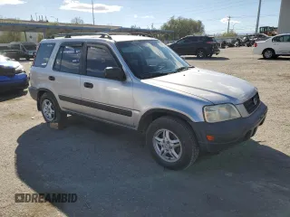 2000 Honda CR-V LX with VIN JHLRD1849YC047923, listed as a Copart auction lot 77041664 with 235,211 mi miles and Salvage Title. Bid and sale history available at carsss.com. Image 4.