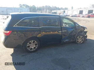 2011 Honda Odyssey EX-L with VIN 5FNRL5H61BB059275, listed as a IAAI auction lot 41293690 with 105,511 mi miles and . Bid and sale history available at carsss.com. Image 13.