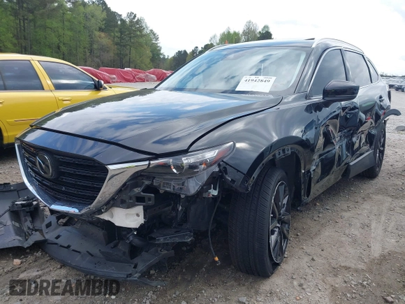 2022 Mazda CX-9 Touring Plus z VIN JM3TCBAYXN0613830, wystawiony jako IAAI lot #41942849 z przebiegiem 50 193 mil mil oraz . Historia ofert i sprzedaży dostępna na DreamBid. Obrazek 22.