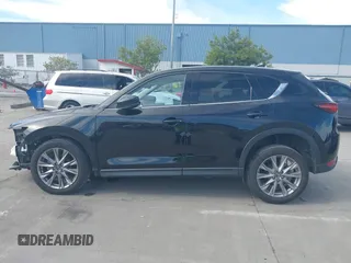 2021 Mazda CX-5 Grand Touring with VIN JM3KFBDM4M1426197, listed as a IAAI auction lot 42004644 with 43,814 mi miles. Bid and sale history available at carsss.com. Image 15.