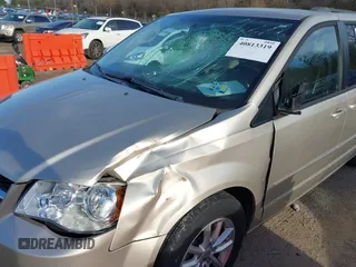 2014 Dodge Grand Caravan SXT with VIN 2C4RDGCG0ER210186, listed as a IAAI auction lot 40813319 with 100,230 mi miles and . Bid and sale history available at DreamBid. Image 6.