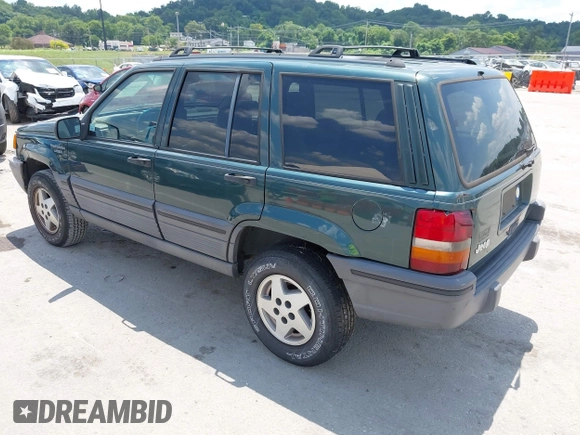 1995 Jeep Grand Cherokee Laredo with VIN 1J4FX58S0SC716398, listed as a IAAI auction lot 42647346 with 58,184 mi miles and . Bid and sale history available at DreamBid. Image 3.