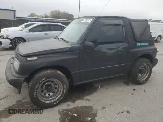 1994 Geo Tracker z VIN 2CNBE18U9R6936156, wystawiony jako Copart lot #45881915 z przebiegiem 201 227 mil mil oraz Szkody całkowita. Historia ofert i sprzedaży dostępna na DreamBid. Obrazek 1.