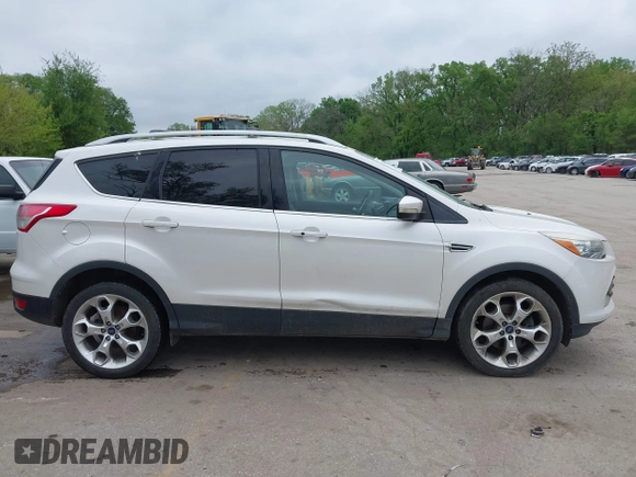 2016 Ford Escape Titanium with VIN 1FMCU9J96GUB97564, listed as a IAAI auction lot 42137663 with 269,009 mi miles. Bid and sale history available at carsss.com. Image 13.